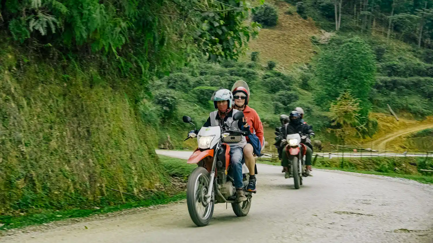 a group of people riding motorcycles on a road-day 3-4-Day Private Tour – Motorbike flipside vietnam ha giang loop